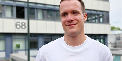 Student standing in front of BCI building