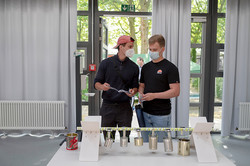 Two students perform an experiment