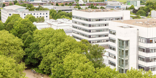 BCI building surrounded by trees