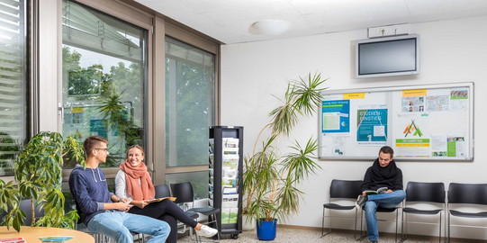 Students sitting in the waiting area of the Central Student Advisory Service