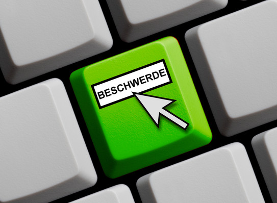  A green colored button with the word "complaint" on it is clicked by the mouse pointer.